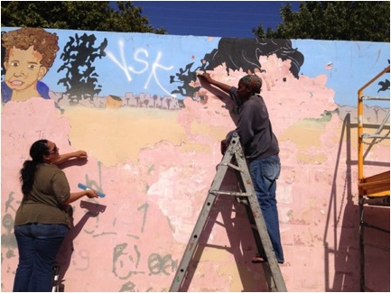 Artists Priming the wall
